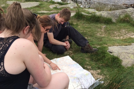 Pupils studying a map at Cwm Idwal, Northern Snowdonia.